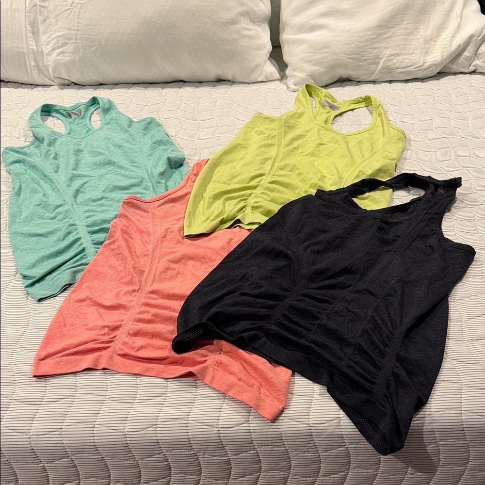 Athleta Four-Pack Tank Tops in Black, Coral, Mint & Lime